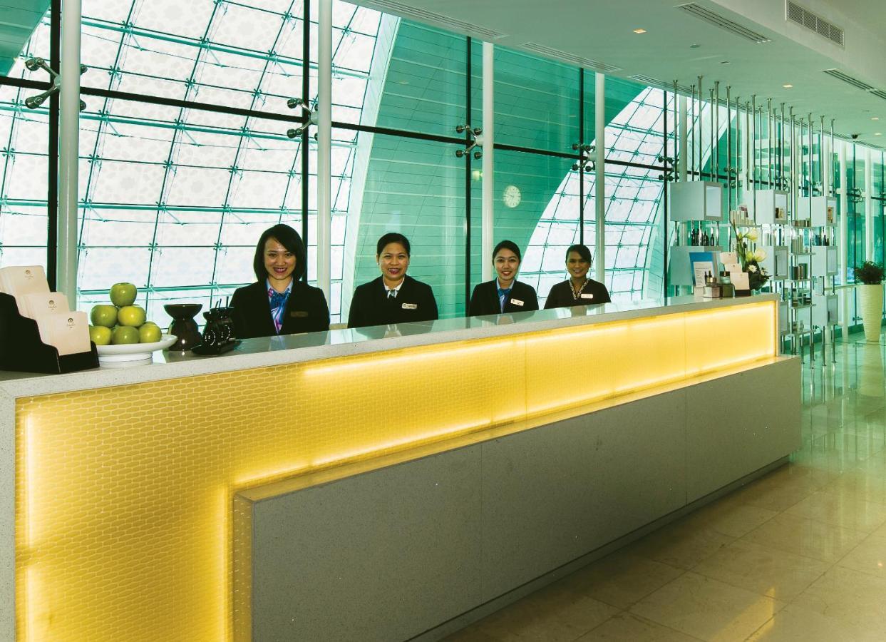 Dubai International Terminal Hotel Exterior photo Reception desk at the airport